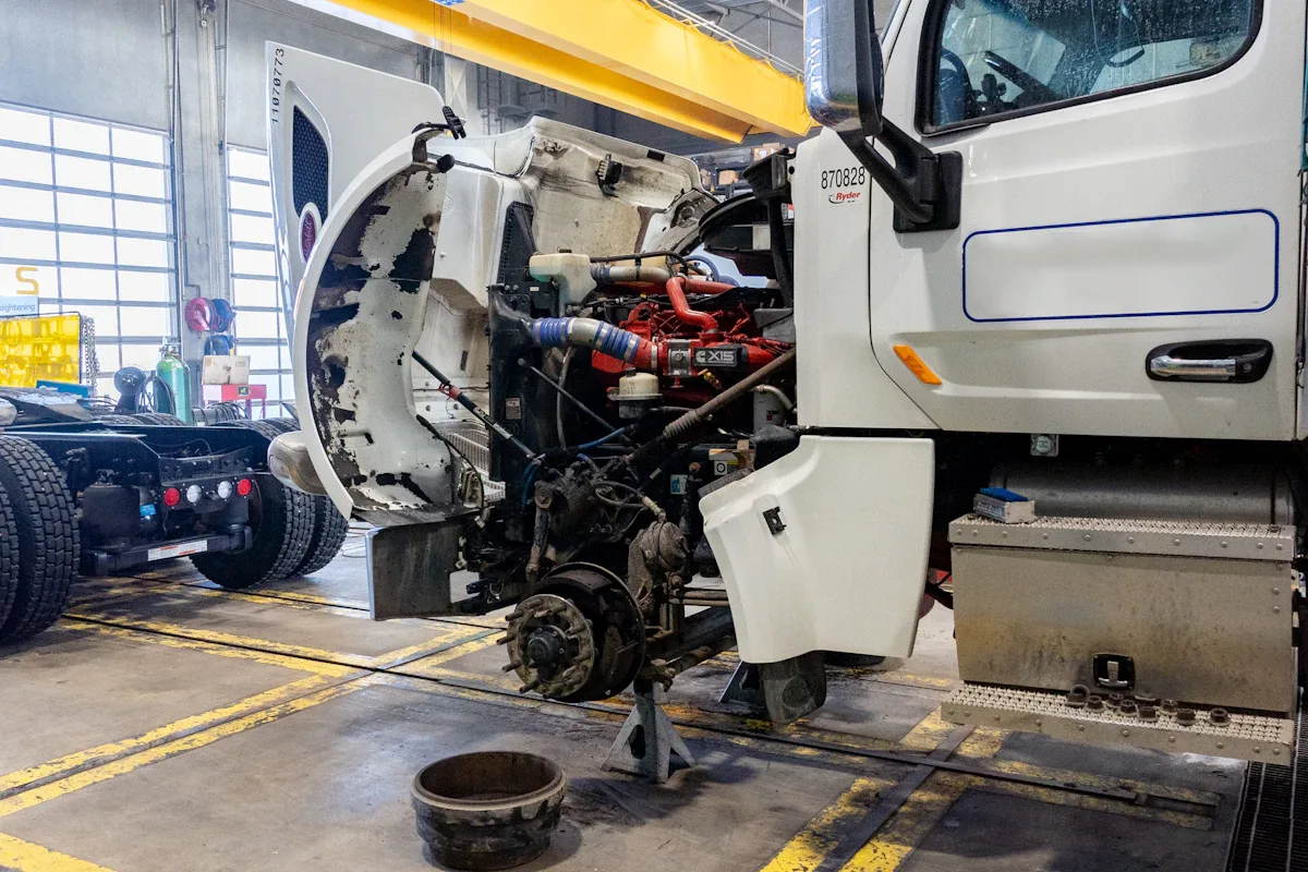 Diesel mechanic performing preventive maintenance services on a semi truck in Edmonton, AB